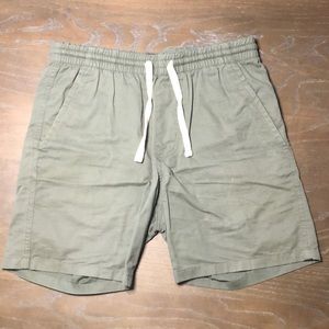 Green Massive Apparel shorts 7 inch seam shorts. Small black spot, no holes.